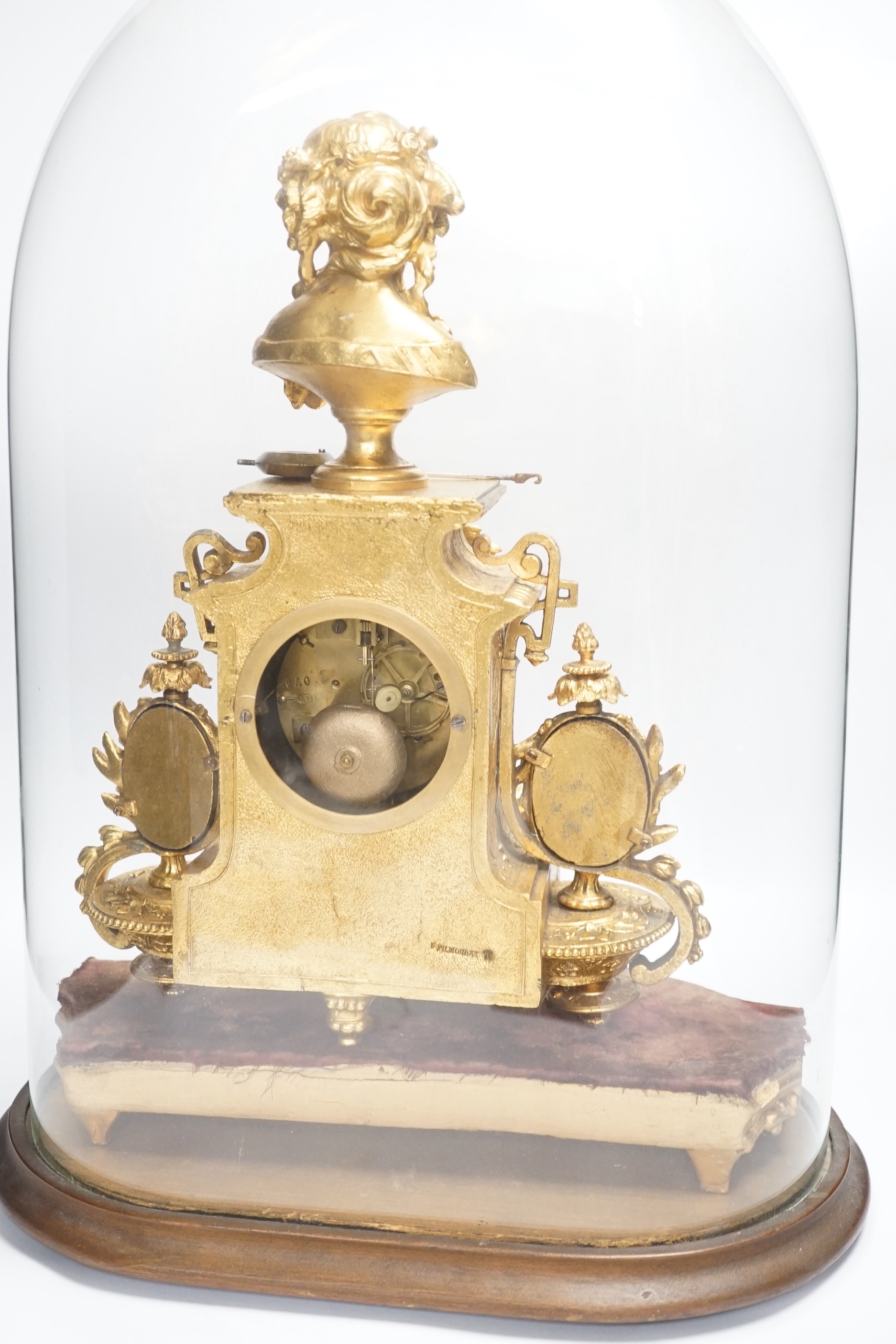 A late 19th century French gilt-spelter mantel clock with enamel panels, under glass dome, 54cm